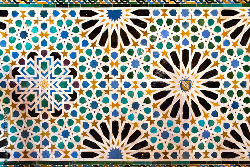 Moorish decoration on a wall of the Alhambra located in Granada, Spain.