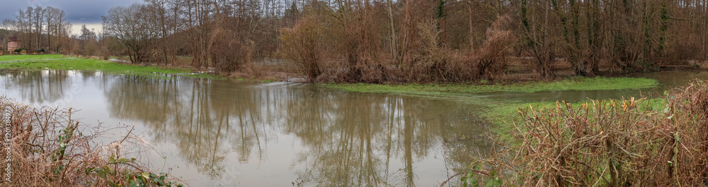 Normandy, France, Europe : Exterior photo view water floods due to climate change in fields creating damage disaster in agriculture environement Normandy, France, Europe : Exterior photo view water floods due to climate change in fields creating damage disaster in agriculture environement
