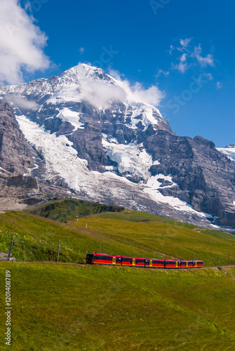 Canvastavla Train moves in the mountains of Switzerland