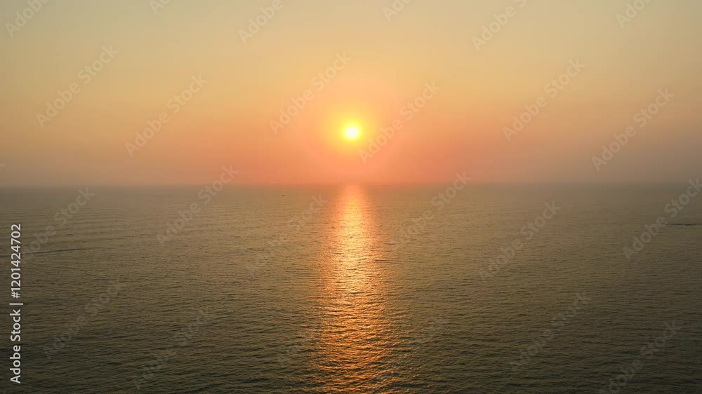 Aerial Drone Shot of the Sun Setting Over the Ocean Horizon Aerial Drone Shot of the Sun Setting Over the Ocean Horizon