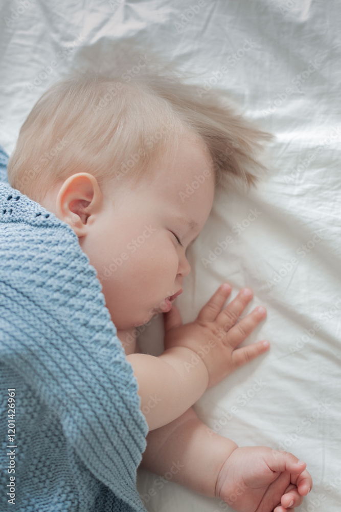 the child fell asleep lying on his side, top view, sleeping baby the child fell asleep lying on his side, top view, sleeping baby
