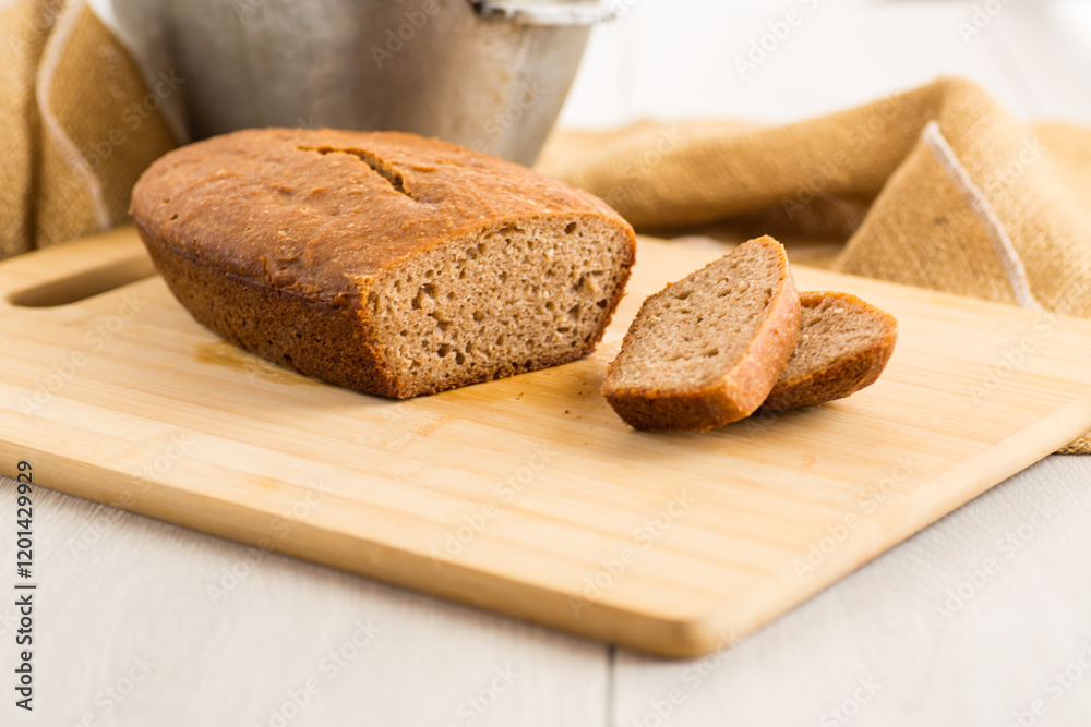Sliced Homemade Bread on a Wooden Board Sliced Homemade Bread on a Wooden Board