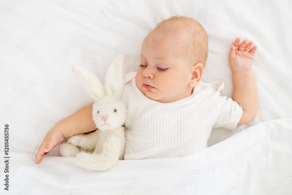 cute little newborn baby sleeping under a blanket hugging a plush bunny, sweet healthy baby sleep in a white crib, a place for text cute little newborn baby sleeping under a blanket hugging a plush bunny, sweet healthy baby sleep in a white crib, a place for text