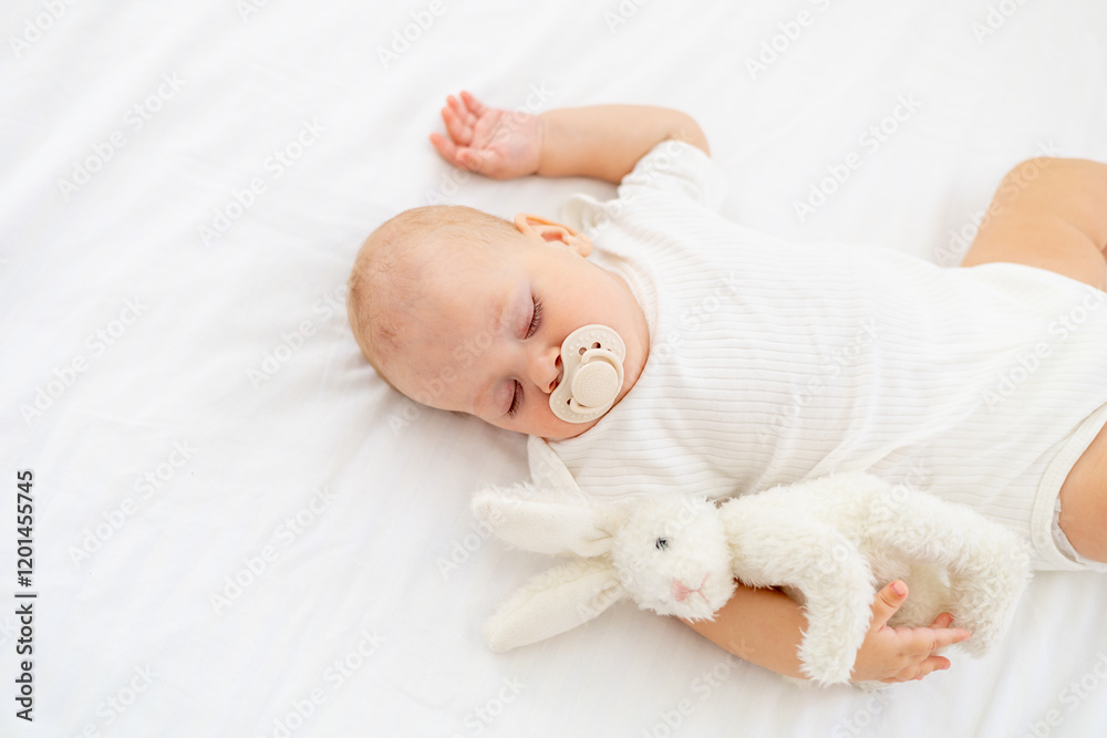 cute little newborn baby sleeping with a pacifier in his mouth under a blanket hugging a plush bunny, sweet healthy baby sleep in a white crib cute little newborn baby sleeping with a pacifier in his mouth under a blanket hugging a plush bunny, sweet healthy baby sleep in a white crib