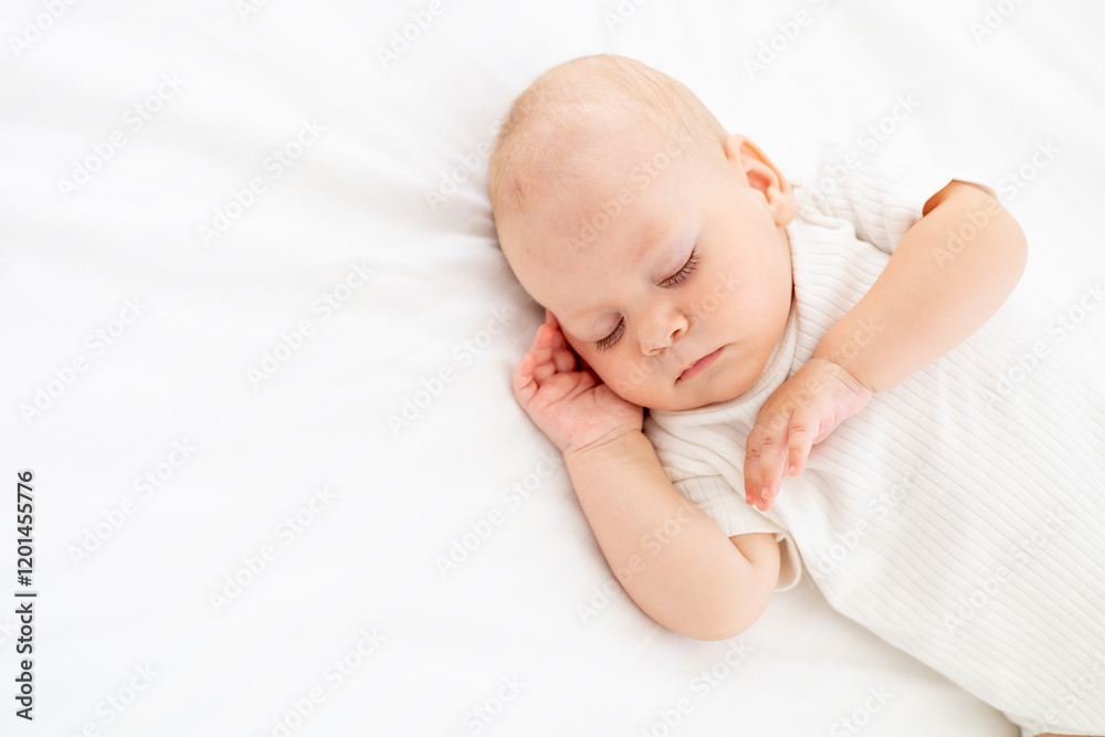 cute little newborn baby sleeps with his hand folded under his cheek, sweet healthy baby sleep in a white crib, a place for text cute little newborn baby sleeps with his hand folded under his cheek, sweet healthy baby sleep in a white crib, a place for text