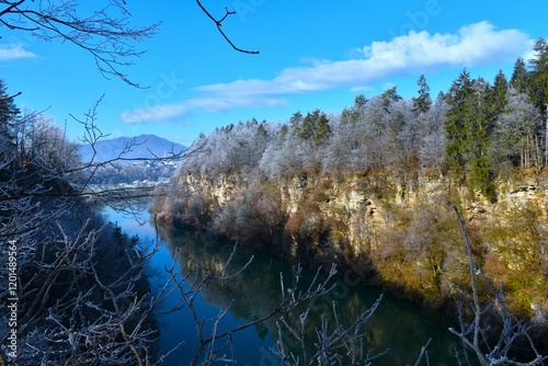 View of Sava river canyon with the trees covered in frost in Gorenjska, Slovenia photo