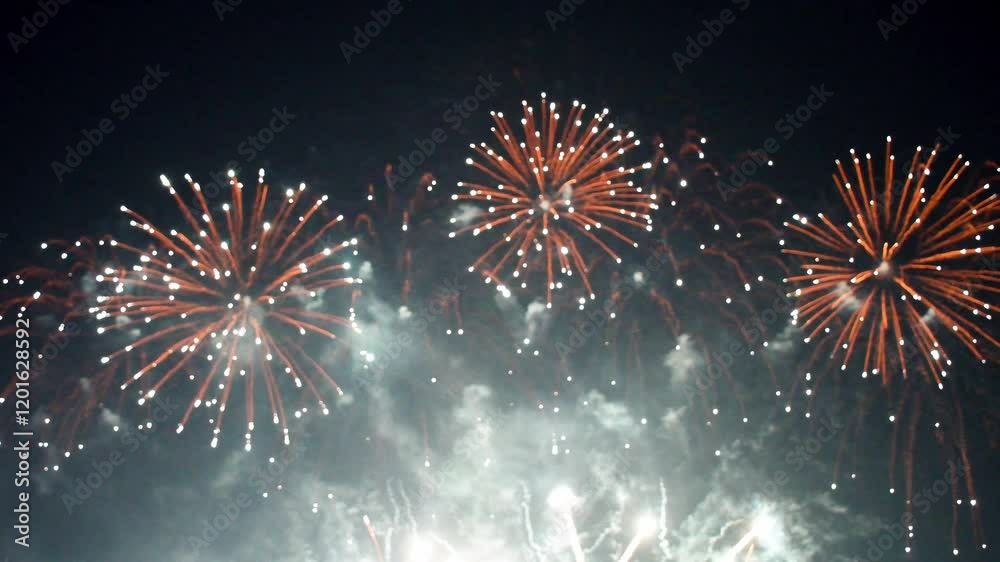 Closed-up of fireworks background with gold fireworks on midnight background.
