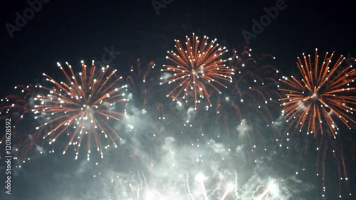 Closed-up of fireworks background with gold fireworks on midnight background.