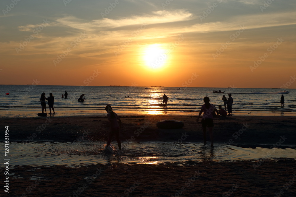 Silhouettes of tourists at Bang Saen beach in the evening. Silhouettes of tourists at Bang Saen beach in the evening.