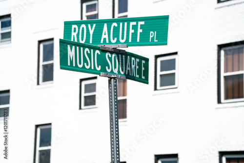 Street signs located at the corner of Roy Acuff Place and Music Square East point to a vibrant area known for its musical heritage and cultural significance in Nashville, Tennessee.