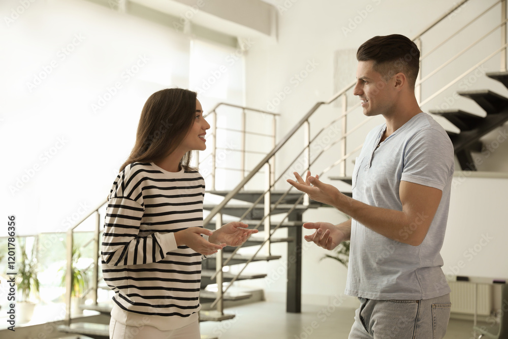 Fototapeta premium Man and woman having conversation in hall