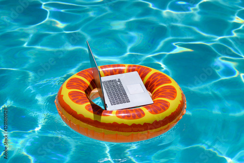 Summer business. Freelance style. Remote working in swimming pool. Summer travelling. Business at summer vacation. Laptop with blank screen. Summer vacation concept.