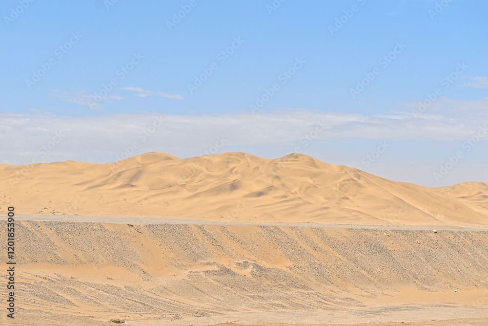 Fototapeta premium barren desert landscape contrasted on blue sky