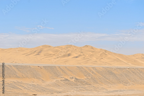 barren desert landscape contrasted on blue sky photo