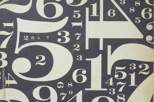 decorative scrapbooking paper with numbers in various font sizes on black