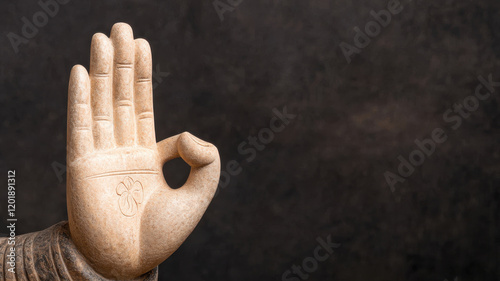 Nirvana Day Themed, close up of sculpted Buddha hand in Abhaya mudra, symbolizing protection and fearlessness