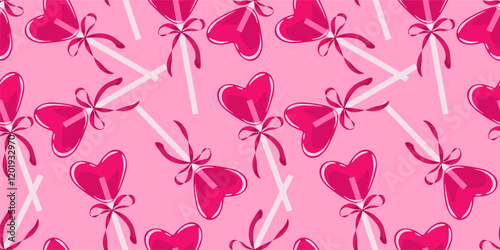 Abstract seamless pattern with pink heart shaped lollipops decorated with bows. Holiday background with hand drawn caramel candies