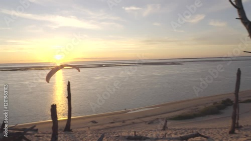 paraglider flying at sunset in dream landscape over dune du pilat in arcachon france