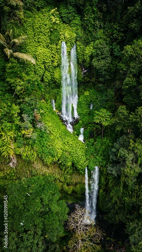 Scenic view of Tiu Kelep Waterfall in Lombok with lush greenery photo