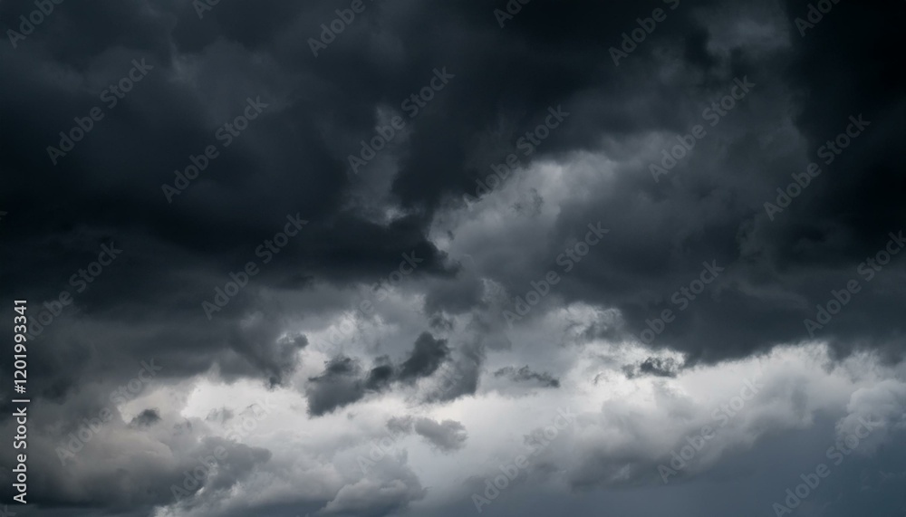 cold overcast sky with dark gray clouds filling the background creating a gloomy and depressive atmosphere with room for text cold overcast sky with dark gray clouds filling the background creating a gloomy and depressive atmosphere with room for text