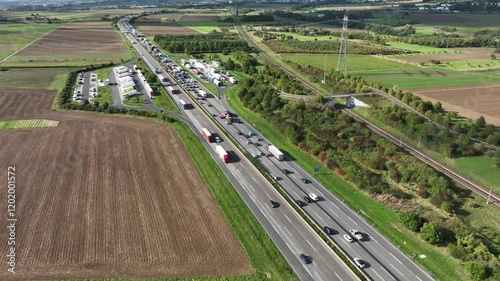 Hochheim, Germany - October 02, 2024: German highway A 3 nearby Wiesbadener Kreuz. Large traffic jam due to rush hour traffic - aerial view