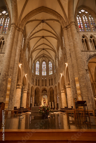 Interior of collegiate church of saint gertrude showing vaulted ceiling and stained glass windows. Belgium tourism