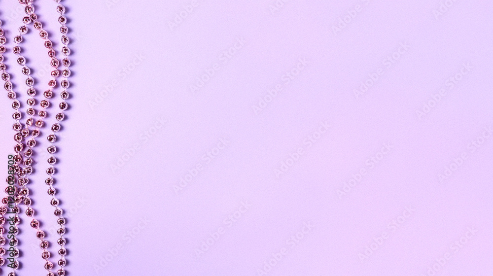 Delicate lavender background with shimmering pink bead accents perfect for elegant designs and festive layouts Delicate lavender background with shimmering pink bead accents perfect for elegant designs and festive layouts