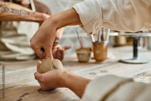 Couple joyfully shaping clay together in a pottery class, strengthening their bond.