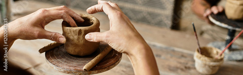 A woman enjoys quality time as she shapes clay during their pottery class, banner