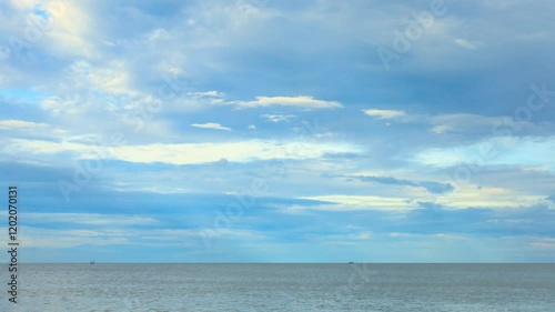 A landscape of sea, beach and cloudy sky, Thailand. 4K 3840x2160. Wide and pan left shot. Time lapse. Can be establishing shot.