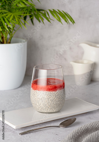 Food photography of breakfast of chia seeds pudding with strawberry puree, berry jam,  healthy vegan dessert, natural food