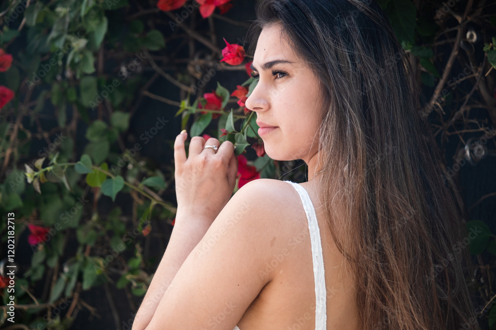 beautiful young woman wearing white summer dress surrounded by bougainvilia flowers beautiful young woman wearing white summer dress surrounded by bougainvilia flowers