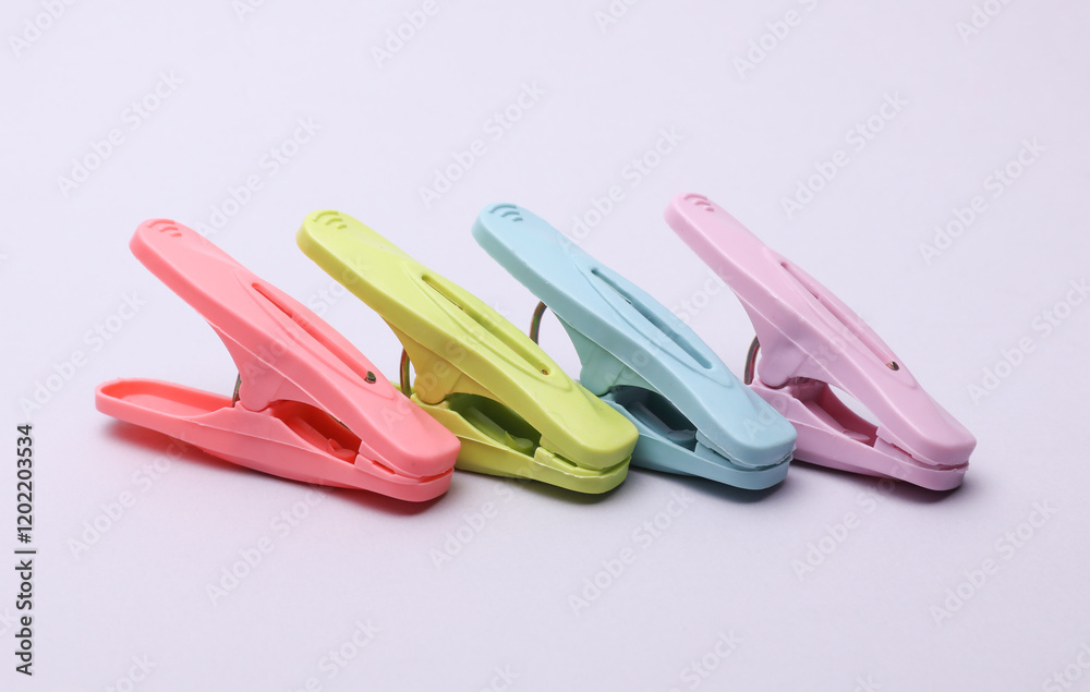 Plastic clothespins on a white background Plastic clothespins on a white background