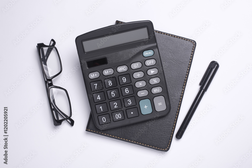 Calculator with notepad on white background. Flat lay Calculator with notepad on white background. Flat lay