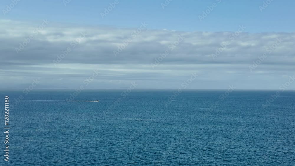 Towering clouds float over the vast expanse of the ocean, showcasing the grandeur of nature.
Towering clouds float over the vast expanse of the ocean, showcasing the grandeur of nature.