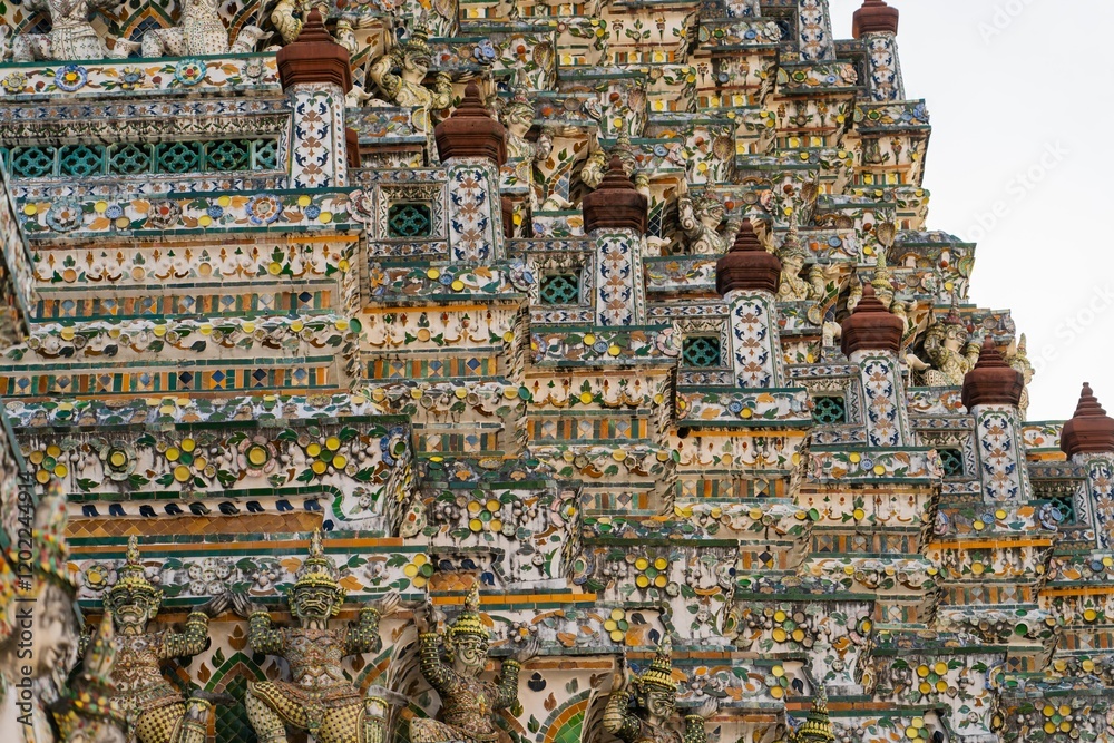 Explore intricate details of Wat Arun temple in Thailand showcasing vibrant colors and ornate designs Explore intricate details of Wat Arun temple in Thailand showcasing vibrant colors and ornate designs