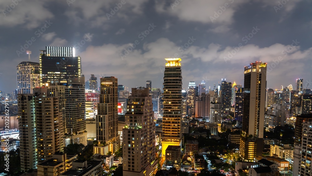 City skyline illuminated at night showcasing modern buildings and vibrant urban life in a bustling metropolitan area City skyline illuminated at night showcasing modern buildings and vibrant urban life in a bustling metropolitan area