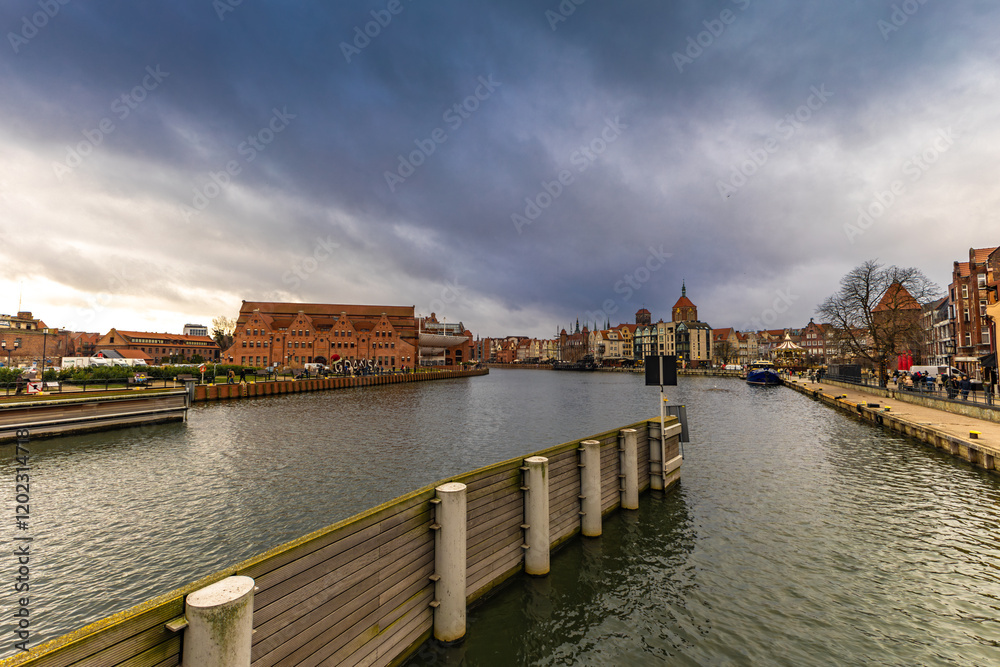 Obraz premium The center of the old town of Gdańsk, a walk along the Motlawa River, historic tenement houses, a market,