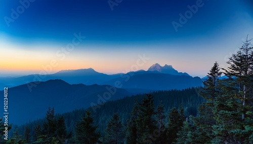 instance of blue peak mountain and hill and darkish blue gradient sunset sky foreground with tree and woodland