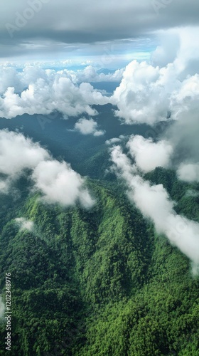 Majestic mountain landscape with clouds and lush greenery under a bright sky