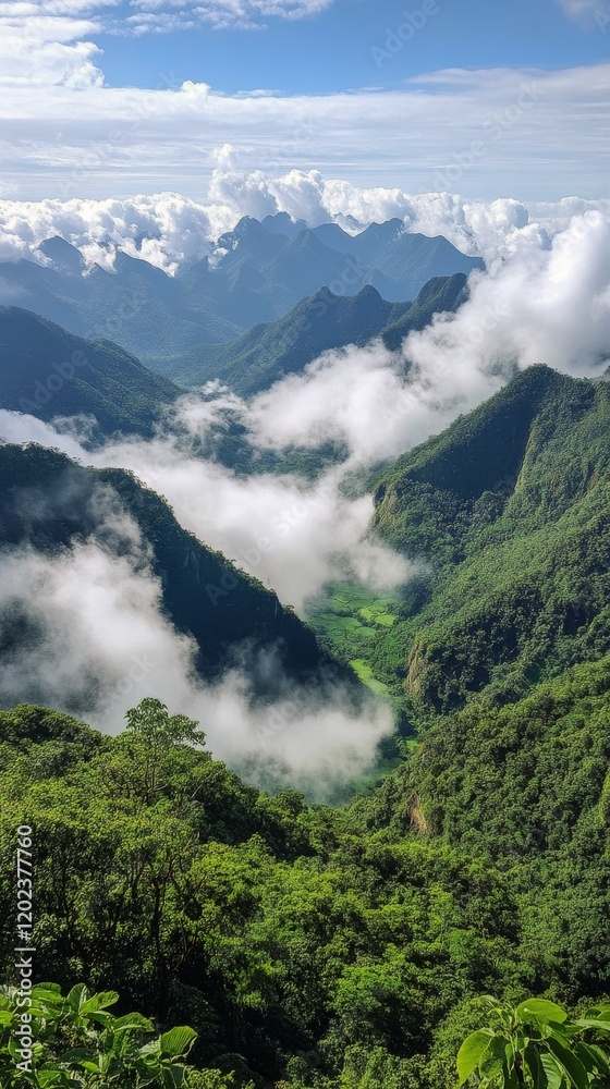 Obraz premium Majestic mountain landscape with clouds and lush greenery under a bright sky