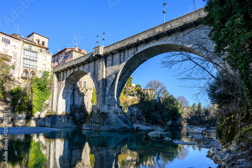 Ancient Bridge Reflecting in River. photo