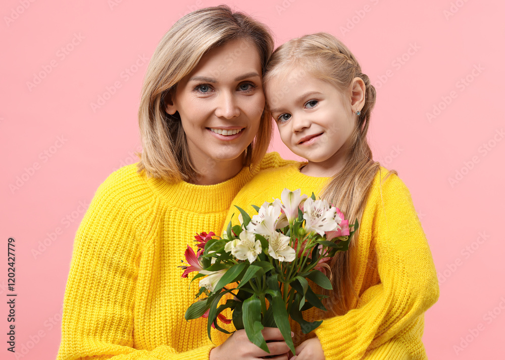 Happy woman with her daughter and bouquet of alstroemeria flowers on pink background. Mother's Day celebration Happy woman with her daughter and bouquet of alstroemeria flowers on pink background. Mother's Day celebration