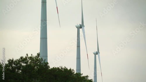 wind turbines spinning blades side view