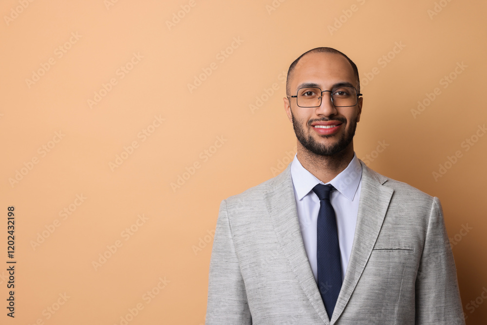Portrait of businessman in glasses on beige background, space for text Portrait of businessman in glasses on beige background, space for text