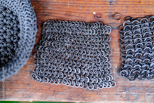 A piece of metal with a lot of loops and a metal ring