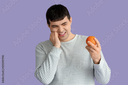 Young man with orange suffe...