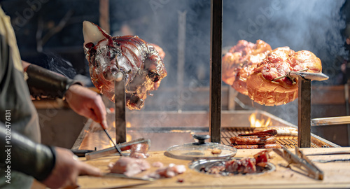 A man is cooking meat on a grill