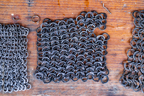 Three pieces of metal with a pattern of circles photo