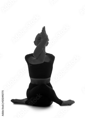 Woman practicing yoga in ea...